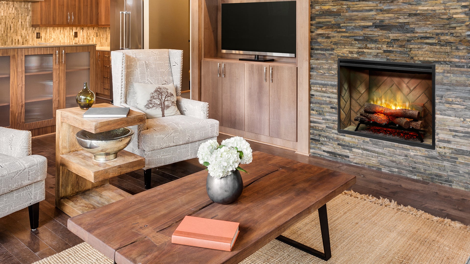 Modern living room with a fireplace, TV, and furniture.